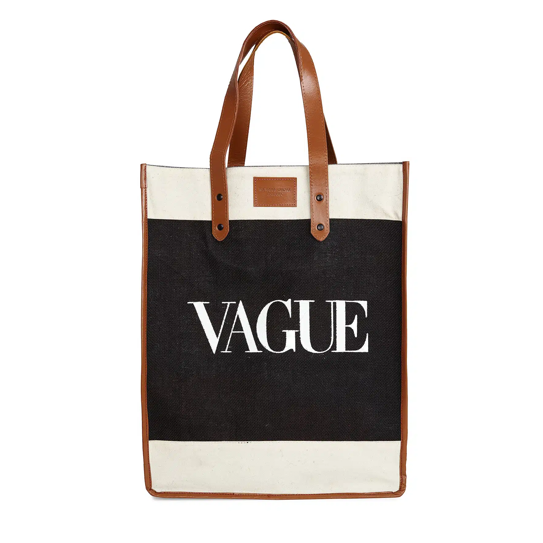 A beige and black tote bag with brown leather handles and accents. The word "Vague" is elegantly printed in large white letters on the black section of the Vague, adding a touch of modern sophistication.