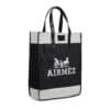 An Airmez black and white tote bag with leather handles featuring the word 