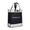 A black and white tote bag with the word 