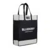 A stylish black and white tote bag with 