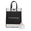 A black and white tote bag featuring the 