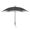 A Karen Walker umbrella - Metro Ecru/Chestnut with a geometric pattern, viewed from above, fully open and displaying its curved canopy and metal ribs.