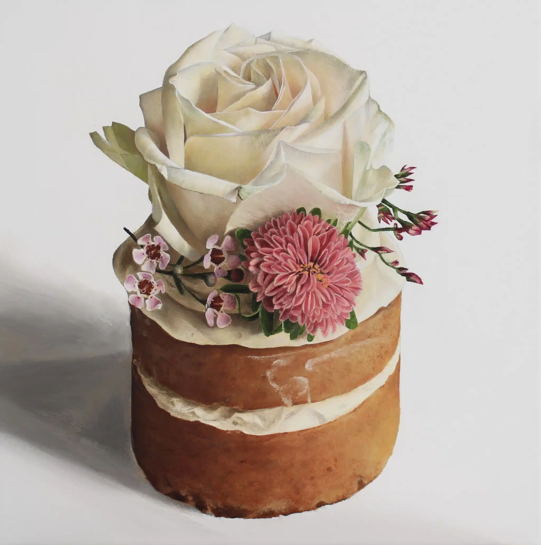 A small, rustic naked cake with layers of light brown sponge and white frosting is adorned with a large white rose, pink chrysanthemum, and tiny pink blossoms on top. The AUTO-DRAFT arrangement gives it an effortlessly elegant look against the plain white background.